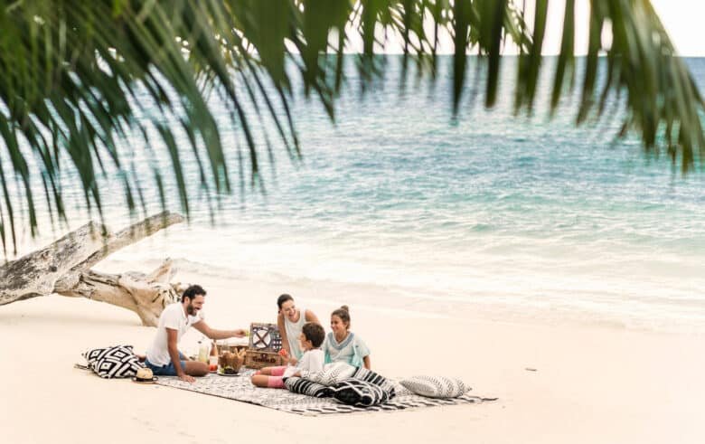 family beach picnic at Four Seasons Seychelles